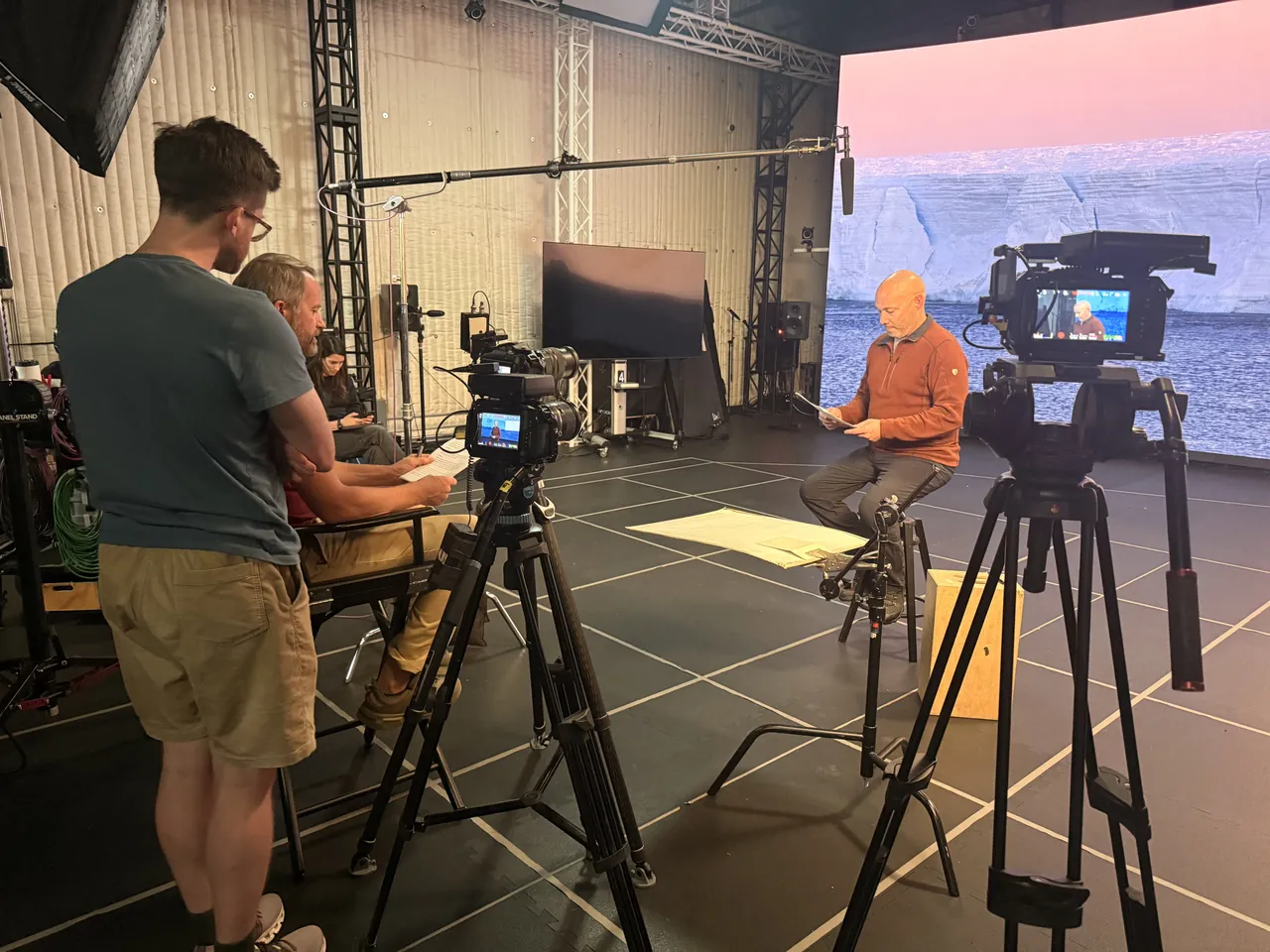 A Blackmagic 6K rig filming an interview in front of an LED wall on a virtual stage